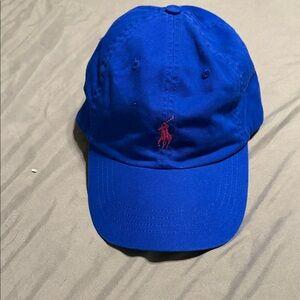 Blue Polo Cap with Red Logo. Adjustable